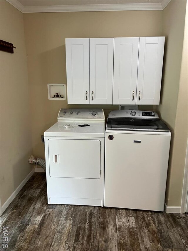 474 Bluffview Dr, Piedmont, MO 63957 - laundry room featuring dark wood-type flooring, cabinet space, baseboards, ornamental molding, and washing machine and dryer