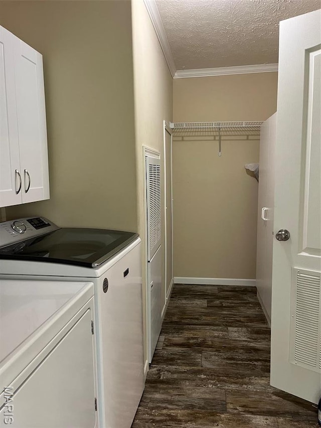 474 Bluffview Dr, Piedmont, MO 63957 - washroom featuring crown molding, cabinet space, dark wood-type flooring, separate washer and dryer, and a textured ceiling