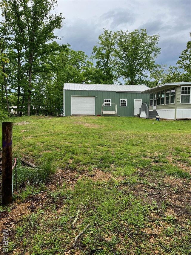 474 Bluffview Dr, Piedmont, MO 63957 - view of outbuilding with a garage and entry steps