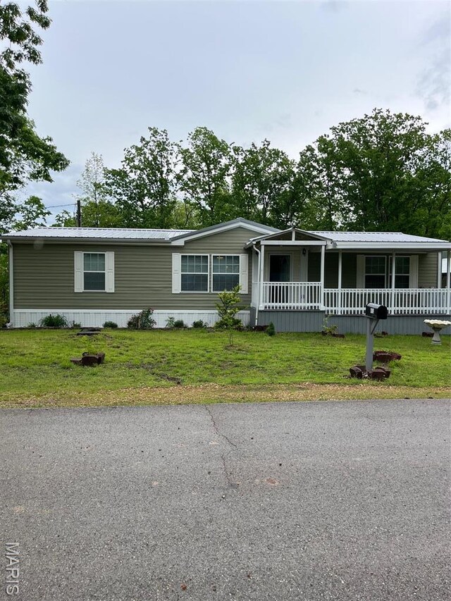 474 Bluffview Dr, Piedmont, MO 63957 - manufactured / mobile home featuring a porch, a front lawn, and metal roof