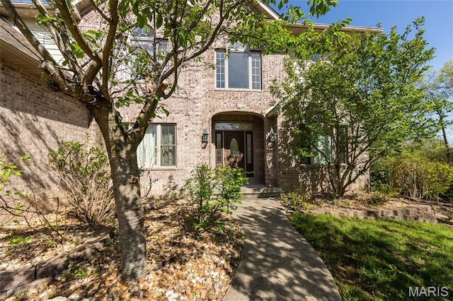 view of front of house with brick siding