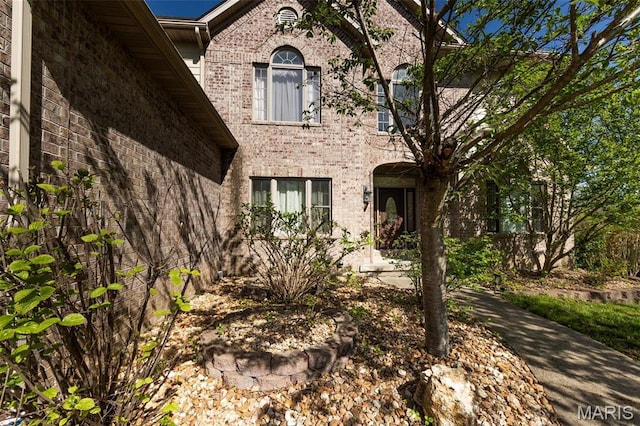 view of front of home featuring brick siding