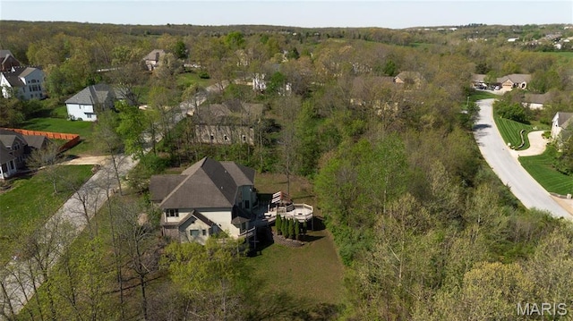 aerial view of residential area with a heavily wooded area