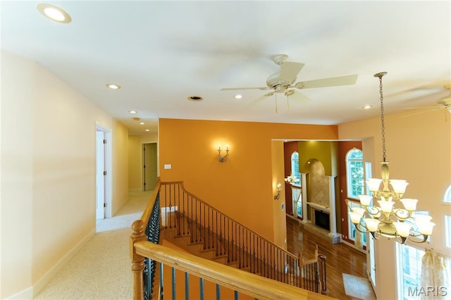 1025 Cobblestone Dr, Rolla, MO 65401 - hall featuring plenty of natural light, recessed lighting, a chandelier, baseboards, and an upstairs landing