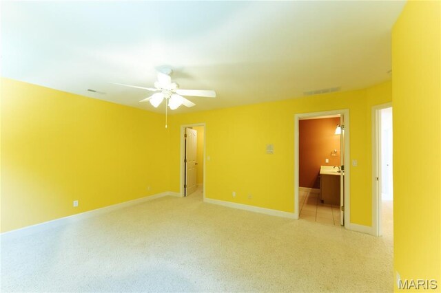 1025 Cobblestone Dr, Rolla, MO 65401 - unfurnished room featuring light colored carpet, a ceiling fan, and baseboards