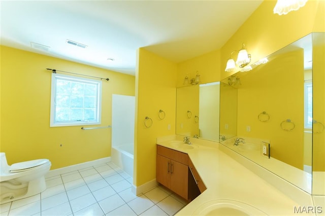 1025 Cobblestone Dr, Rolla, MO 65401 - full bath with double vanity, toilet, baseboards, and tile patterned flooring