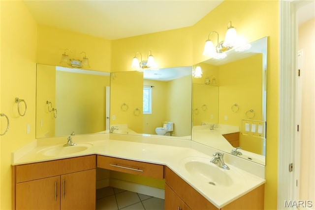 1025 Cobblestone Dr, Rolla, MO 65401 - full bathroom with double vanity, tile patterned flooring, and toilet