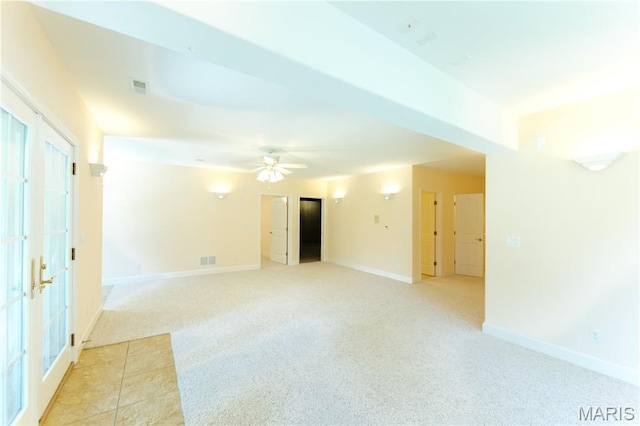 1025 Cobblestone Dr, Rolla, MO 65401 - unfurnished room featuring light carpet, baseboards, a ceiling fan, and french doors