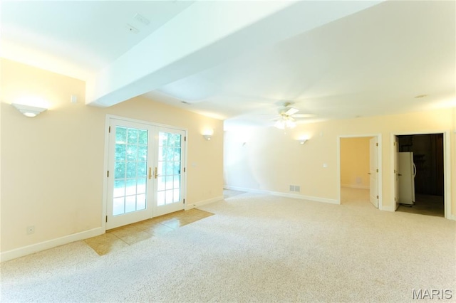 1025 Cobblestone Dr, Rolla, MO 65401 - empty room with light colored carpet, ceiling fan, baseboards, and french doors