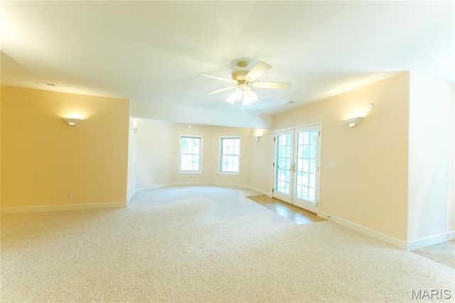 1025 Cobblestone Dr, Rolla, MO 65401 - empty room featuring baseboards, light carpet, a ceiling fan, and french doors