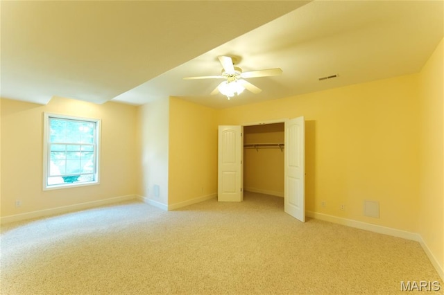 1025 Cobblestone Dr, Rolla, MO 65401 - unfurnished bedroom featuring light carpet, baseboards, a closet, and ceiling fan