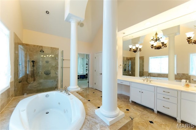 1025 Cobblestone Dr, Rolla, MO 65401 - full bath with decorative columns, a jetted tub, double vanity, tiled shower, and a chandelier
