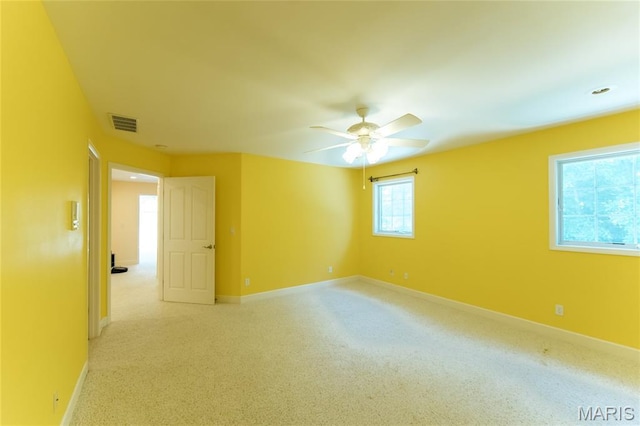 1025 Cobblestone Dr, Rolla, MO 65401 - empty room with ceiling fan, baseboards, and light colored carpet