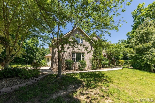 1025 Cobblestone Dr, Rolla, MO 65401 - view of home's exterior with a yard