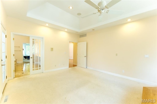 1025 Cobblestone Dr, Rolla, MO 65401 - unfurnished bedroom with recessed lighting, light colored carpet, baseboards, and a raised ceiling