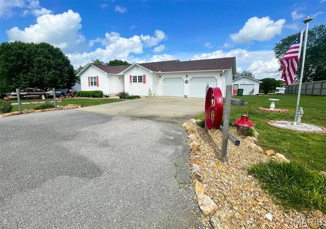 11652 Two Mile Rd, Dexter, MO 63841 - ranch-style home featuring asphalt driveway and a garage