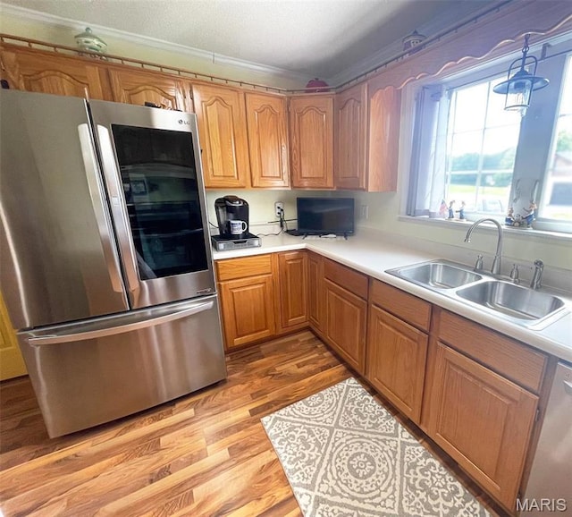 11652 Two Mile Rd, Dexter, MO 63841 - kitchen featuring smart refrigerator, light countertops, light wood-style floors, crown molding, and dishwashing machine