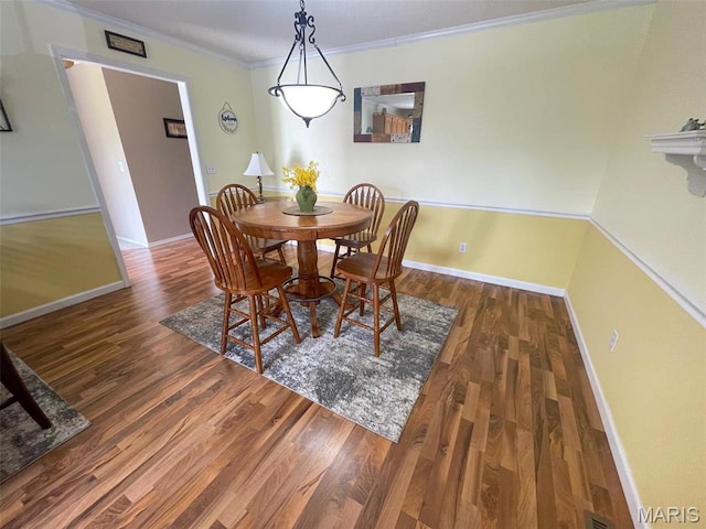 11652 Two Mile Rd, Dexter, MO 63841 - dining room with wood finished floors and ornamental molding