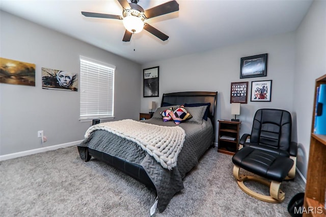 bedroom with carpet flooring, baseboards, and a ceiling fan