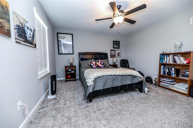 bedroom with carpet, a ceiling fan, and baseboards