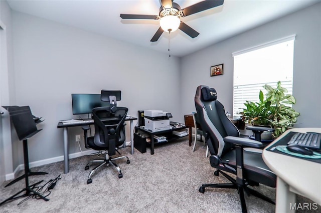 office area with carpet floors, baseboards, and a ceiling fan