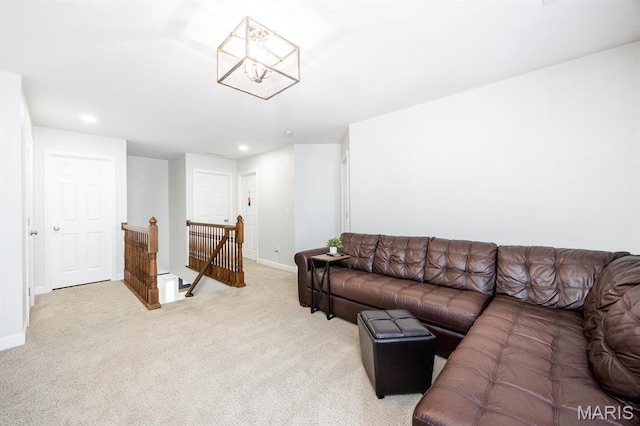 living area featuring light colored carpet, recessed lighting, baseboards, and a chandelier