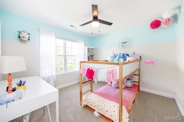 carpeted bedroom featuring baseboards and ceiling fan