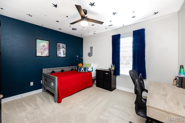 bedroom with carpet flooring, baseboards, and a ceiling fan