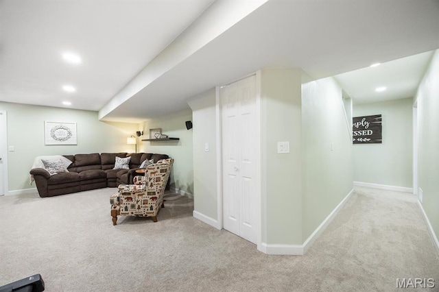 living room featuring carpet, baseboards, and recessed lighting
