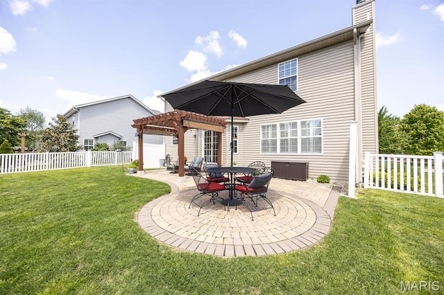 back of property featuring a pergola, a patio, and a chimney