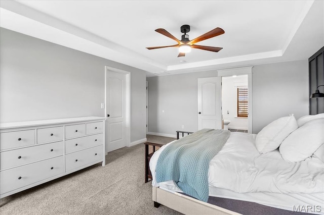 6 Bradley Ct, Troy, IL 62294 - bedroom with a raised ceiling, light colored carpet, connected bathroom, and baseboards