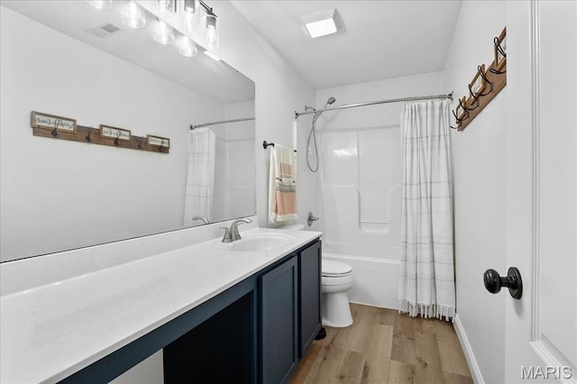 6 Bradley Ct, Troy, IL 62294 - bathroom featuring wood finished floors, vanity, toilet, and shower / bathtub combination with curtain