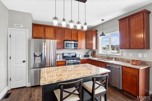 6 Bradley Ct, Troy, IL 62294 - kitchen with appliances with stainless steel finishes, dark wood-style flooring, a sink, and light stone counters