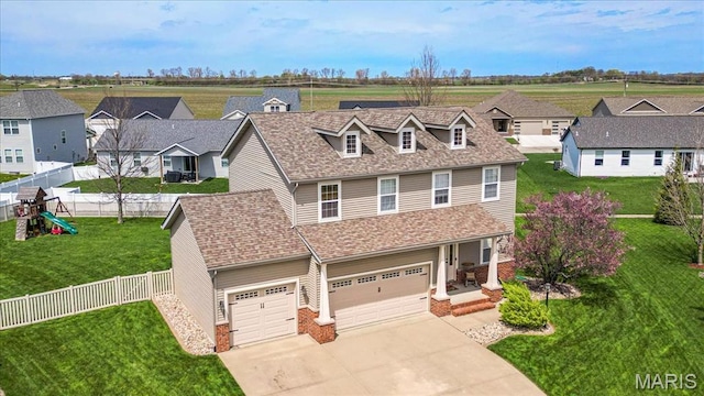 6 Bradley Ct, Troy, IL 62294 - view of front of property with concrete driveway, a garage, a residential view, and a shingled roof
