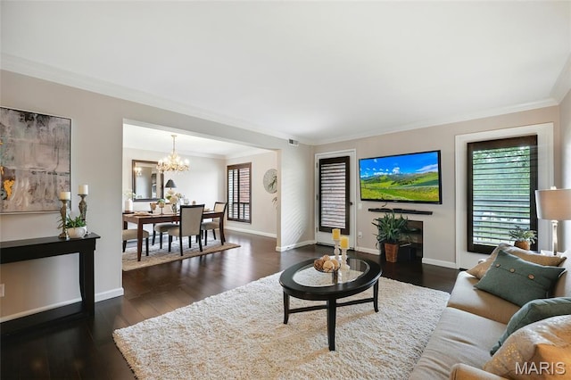 585 Coeur De Royale Dr Unit 203, Creve Coeur, MO 63141 - living area with healthy amount of natural light, crown molding, a chandelier, and dark wood-style floors