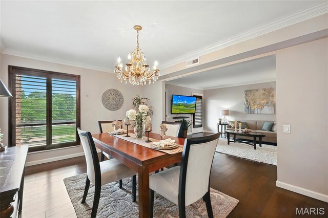 585 Coeur De Royale Dr Unit 203, Creve Coeur, MO 63141 - dining area with a chandelier, crown molding, and dark wood finished floors