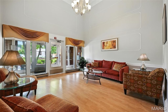585 Coeur De Royale Dr Unit 203, Creve Coeur, MO 63141 - living room with a chandelier, light wood-style floors, and a towering ceiling