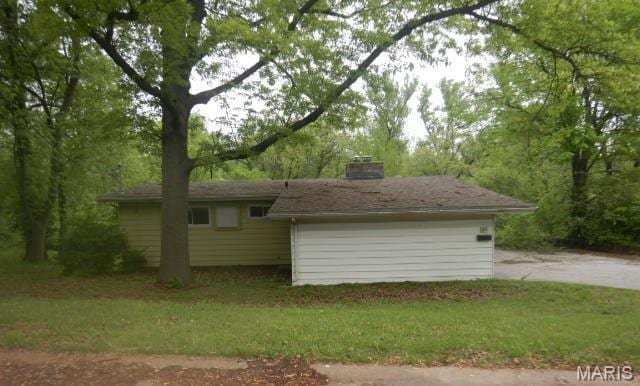 521 Plantmore Dr, Saint Louis, MO 63135 - view of side of property with a lawn and a chimney