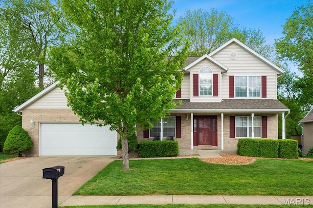 1138 Illini Dr, Ofallon, IL 62269 - traditional-style home featuring concrete driveway, brick siding, a garage, and a front lawn