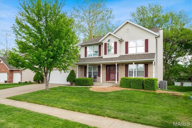 1138 Illini Dr, Ofallon, IL 62269 - traditional home featuring driveway, an attached garage, a front lawn, covered porch, and cooling unit