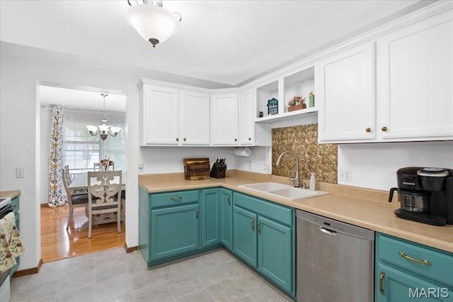 1138 Illini Dr, Ofallon, IL 62269 - kitchen featuring stainless steel dishwasher, a sink, open shelves, white cabinetry, and light countertops