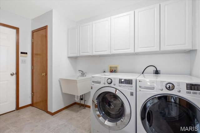 1138 Illini Dr, Ofallon, IL 62269 - washroom with cabinet space, washing machine and dryer, and baseboards