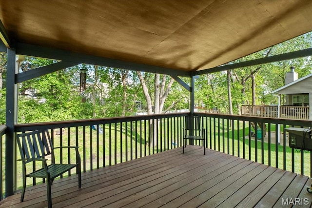 1138 Illini Dr, Ofallon, IL 62269 - wooden deck with a lawn and view of scattered trees