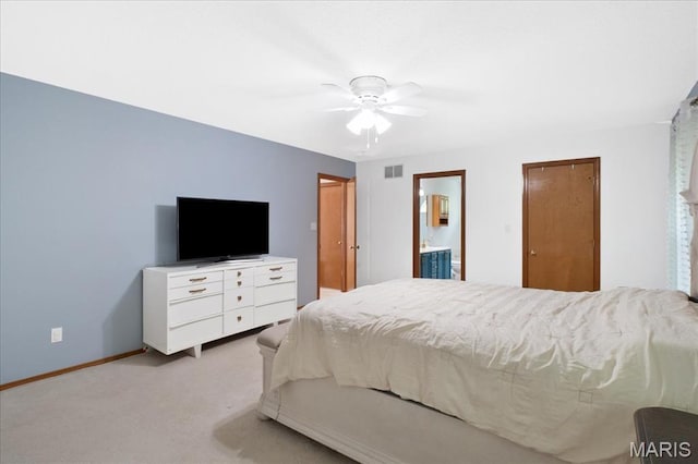 1138 Illini Dr, Ofallon, IL 62269 - bedroom with light carpet, baseboards, ensuite bathroom, and a ceiling fan