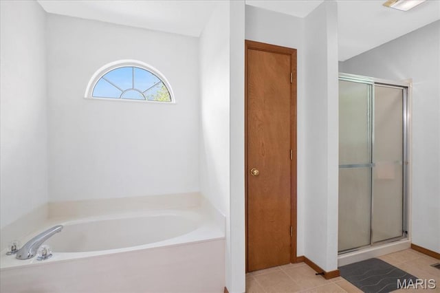 1138 Illini Dr, Ofallon, IL 62269 - bathroom with a shower stall, a bath, and tile patterned flooring