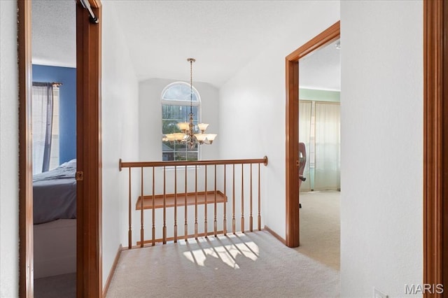 1138 Illini Dr, Ofallon, IL 62269 - corridor with carpet, a chandelier, and vaulted ceiling