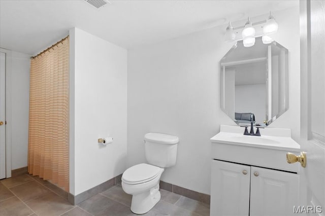 1138 Illini Dr, Ofallon, IL 62269 - bathroom with toilet, vanity, and baseboards