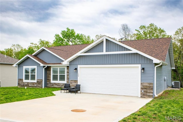 159 Mesa Dr, Waynesville, MO 65583 - view of front of home with stone siding, a shingled roof, concrete driveway, an attached garage, and central AC unit