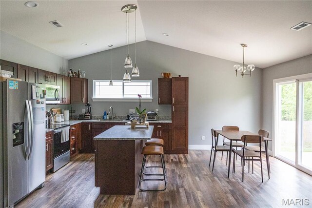 159 Mesa Dr, Waynesville, MO 65583 - kitchen featuring stainless steel appliances, lofted ceiling, a sink, dark wood finished floors, and a center island