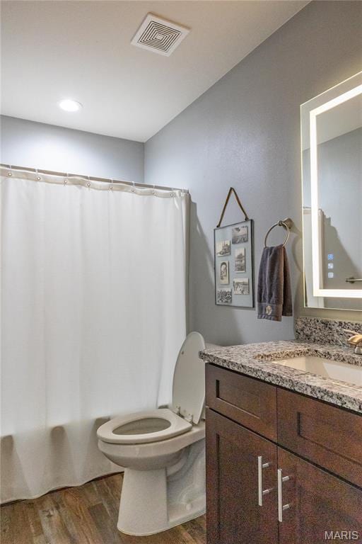 159 Mesa Dr, Waynesville, MO 65583 - full bath with wood finished floors, toilet, vanity, and shower / tub combo with curtain